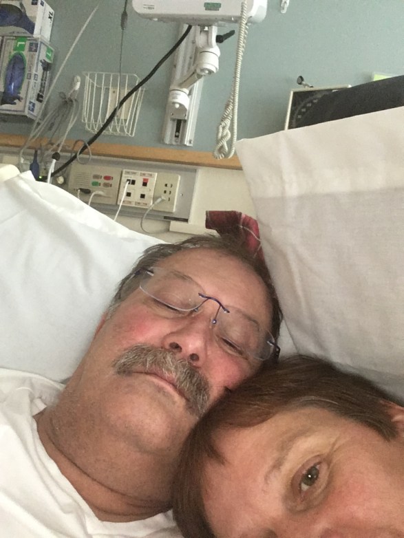 Denise and Mike in bed at the hospital